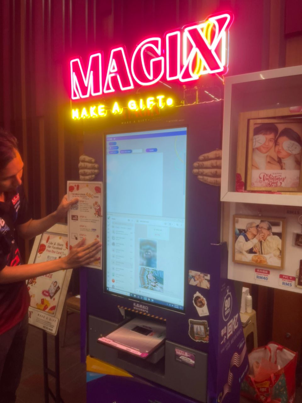 Magix neon signboard glowing above a kiosk