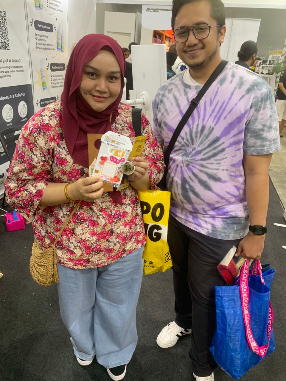 A couple laughing with their freshly printed keepsakes